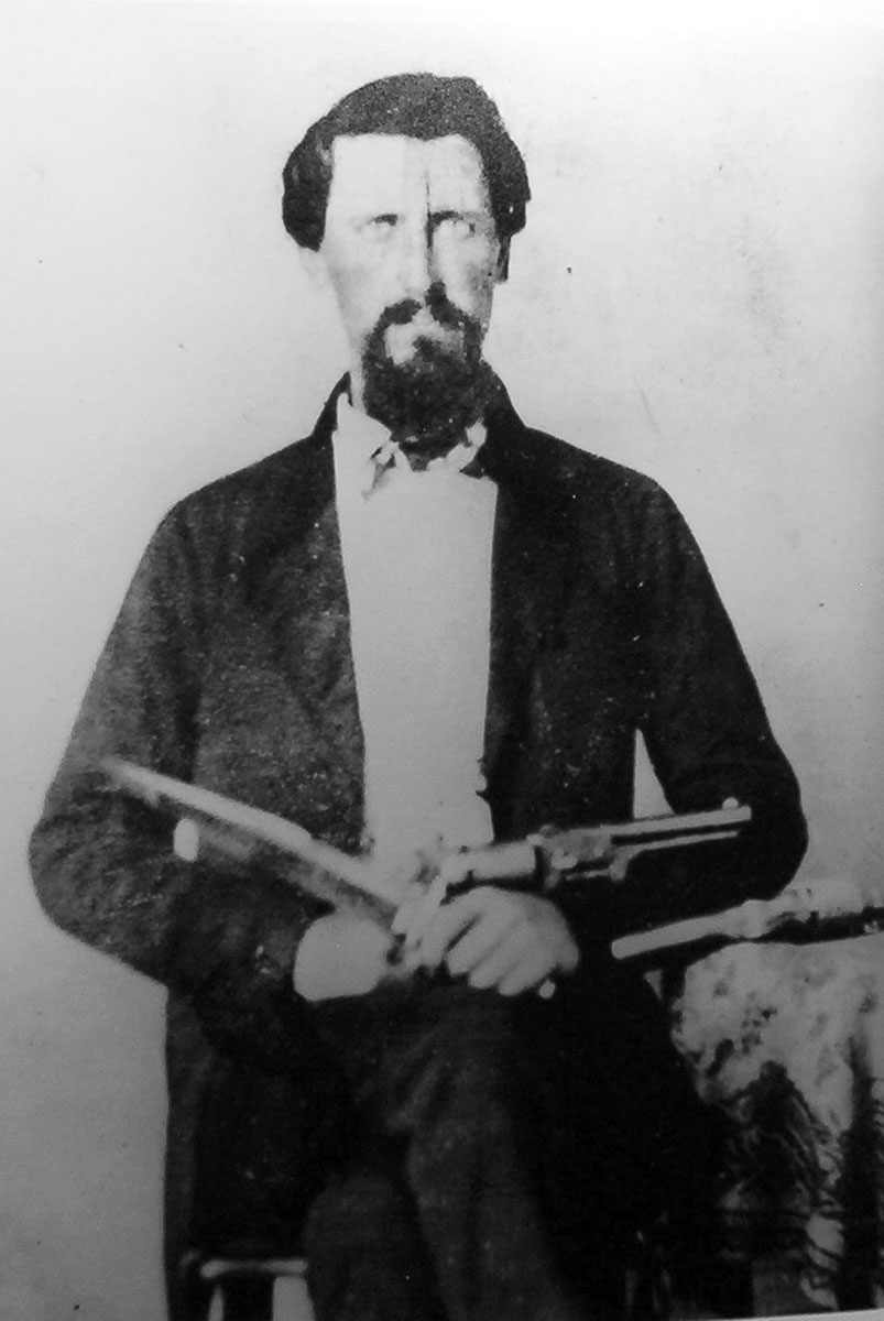 Marshall Cleveland, a Jayhawker, pictured with a Colt Dragoon and a fighting knife.